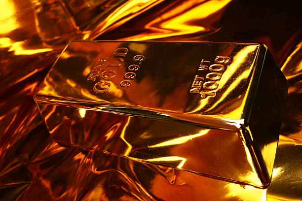 istock Gold bars on a golden background 2244156587