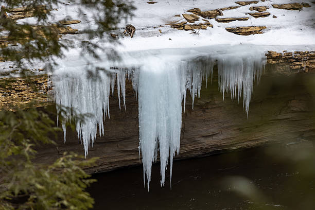 Ice formation along Sainte-Anne River at Parc Naturel Regional de Portneuf, Quebec, Canada during winter.