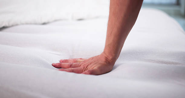 istock Man Chooses Soft Memory Foam Mattress Topper 2244161714
