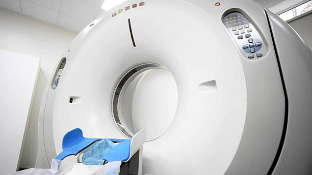 istock CT scanner machine in a medical facility, showcasing advanced technology with a patient bed and diagnostic equipment, emphasizing modern x-ray tomography capabilities for healthcare 2244162702