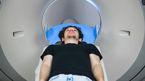 istock Patient undergoing CT scan procedure inside advanced medical imaging machine, showcasing technology and healthcare environment for diagnostic purposes 2244162772