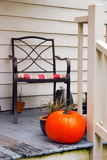 istock Halloween pumpkin and decorations on a porch 2244163116