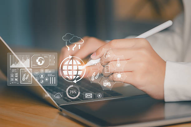 istock Business professional analyzing AI and IoT agriculture dashboard on laptop with smart data interface, showing soil monitoring, crop analytics, climate control for precision and sustainable farming. 2244163457