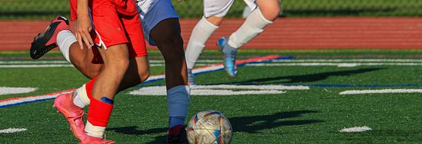 istock Exciting Soccer Match Between Players on a Sunny Day 2244164580
