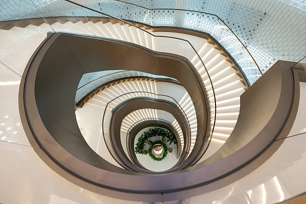 istock Overlooking the indoor spiral staircase 2244165148