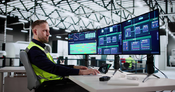 istock Man Wearing Helmet Monitors Factory Production 2244166358