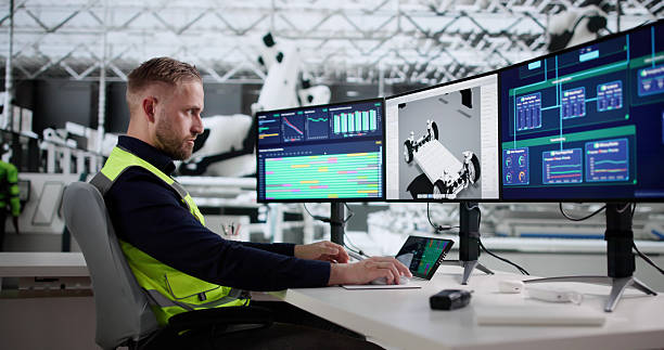 istock High Tech Assembly Line: Young Engineer Monitoring Vehicle Production 2244166363