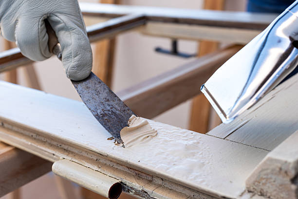 istock Carpenter at work, restoring an old wooden window. Carpentry. 2244167025