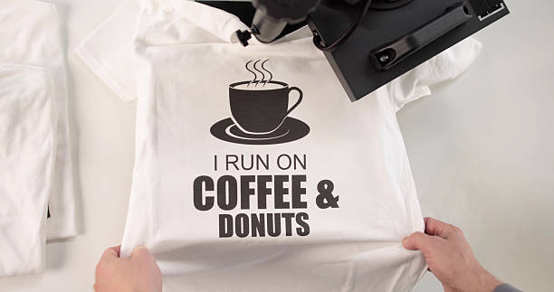 istock The Young Man Customizes T-shirts With His Heat Transfer Press 2244167975