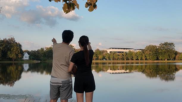 istock A couple standing by a lake, looking at the water 2244172582