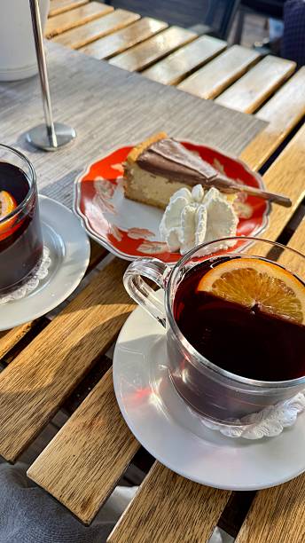istock mulled wine with orange in a cup and cake 2244173717