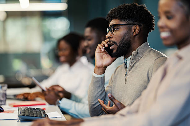 istock African american businessman talking on mobile phone at office 2244174597