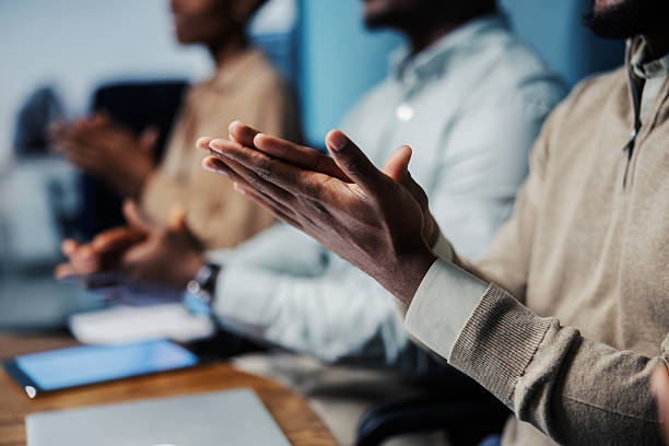 istock Business people clapping hands expressing appreciation at meeting 2244174726
