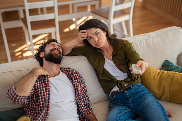 istock Couple suffering from heat and boredom on sofa 2244174914