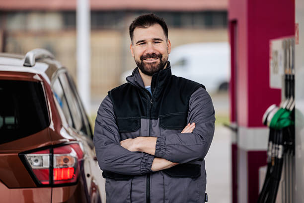 istock Confident Gas Station Worker in Uniform Smiling at Camera 2244175809