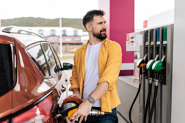 istock Man Refueling Car at Gas Station 2244178500