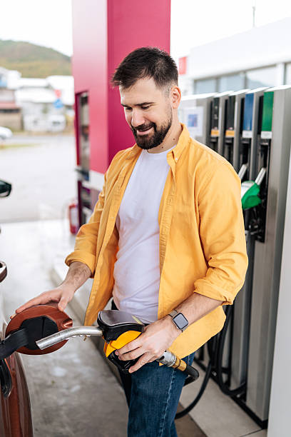 istock Man Refueling Car at Gas Station 2244178506