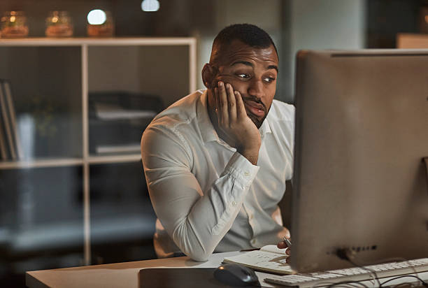istock Tired Businessman Resting At Desk While Working On Computer In Modern Office At Night 2244179547