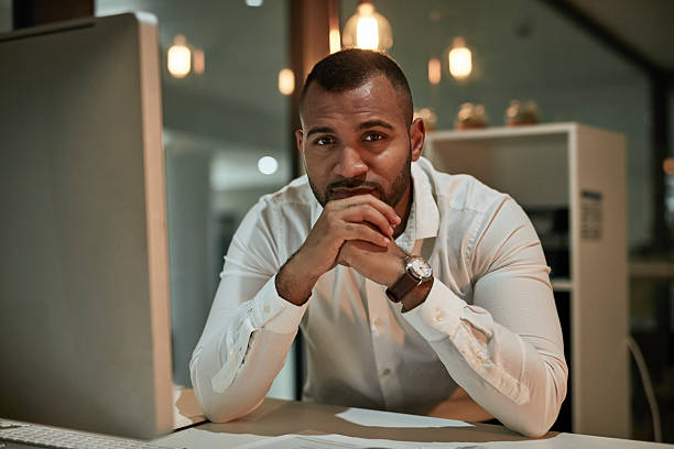 istock Thoughtful Business Professional At Desk In Modern Office Setting With Computer, Professional Attire, Focused And Confident 2244180039