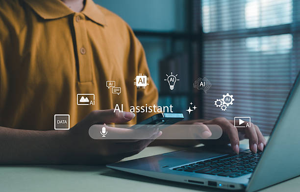 istock Person using smartphone and laptop with AI assistant technology, digital interface icons for data, automation, machine learning, and innovative business solutions in modern communication. 2244181156