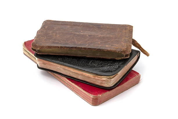 istock Stack of antique books with leather covers on a white background 2244186873