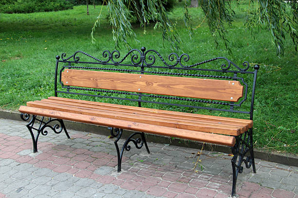 Wooden bench in a park with mass attendance and recreation