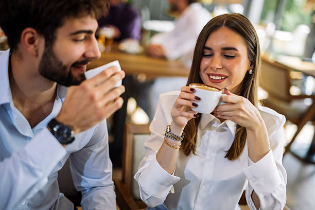 istock Couple drinking coffee in cafe 2244191361