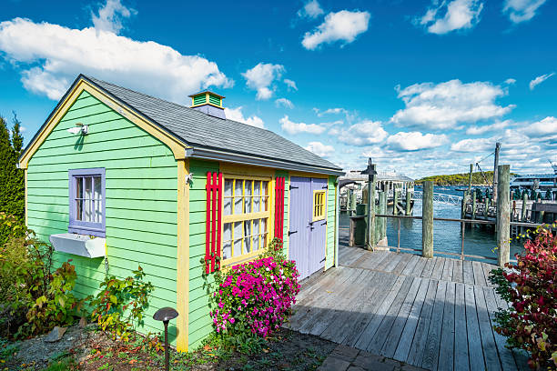 Colorful kiosk on the waterfront in Bar Harbor, Maine, USA, on a sunny day.