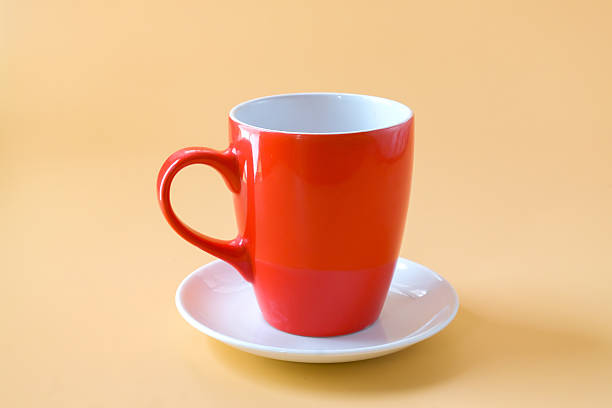 istock Red cup mug on white plate ,Red coffee cup. 2244193804