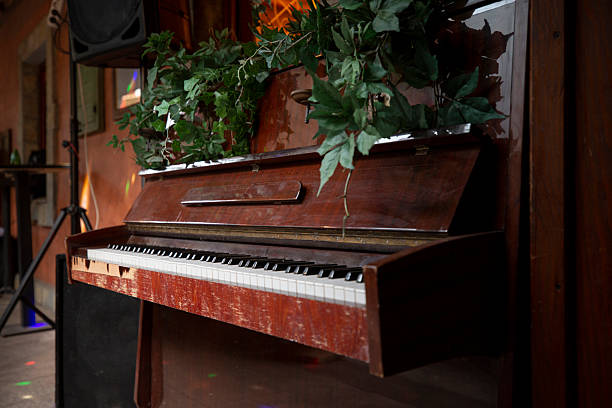 istock Vintage piano repurposed as decorative element with ivy leaves 2244194028