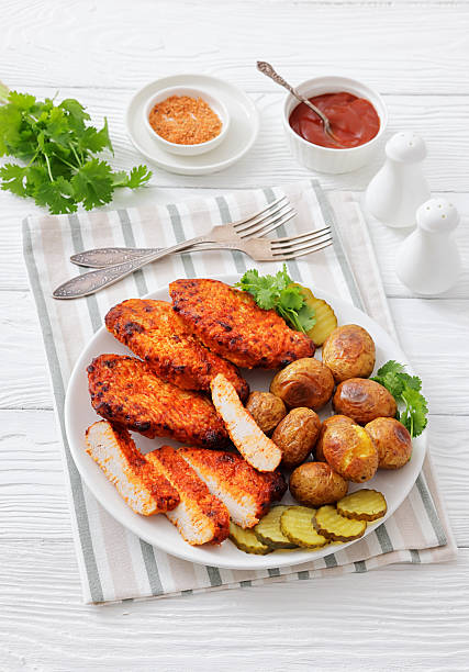 istock Paprika-Rubbed Pork Chops on plate with potatoes 2244196261