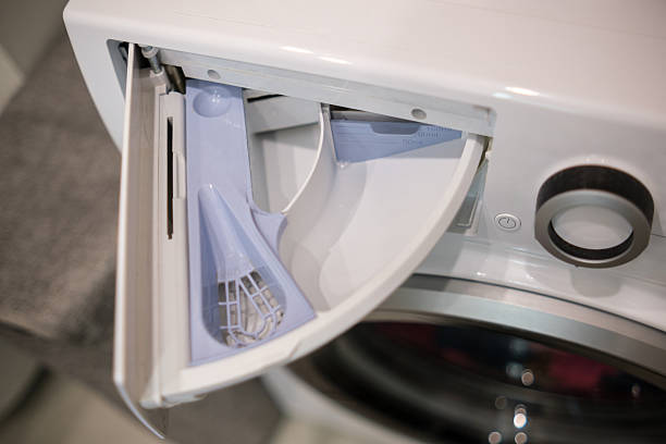 istock Modern Washing Machine Drawer Open With Detergent Compartment Visible in a Clean Laundry Room Setting 2244196812