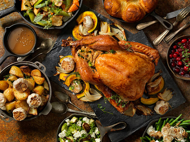 istock Roasted Turkey Thanksgiving Dinner Feast with Traditional Side Dishes 2244199169