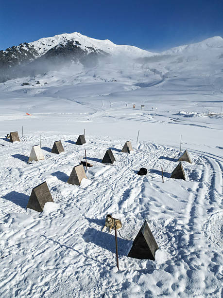 Winter Camping Tents in Snow-Covered Mountain Valley Alpine Setting