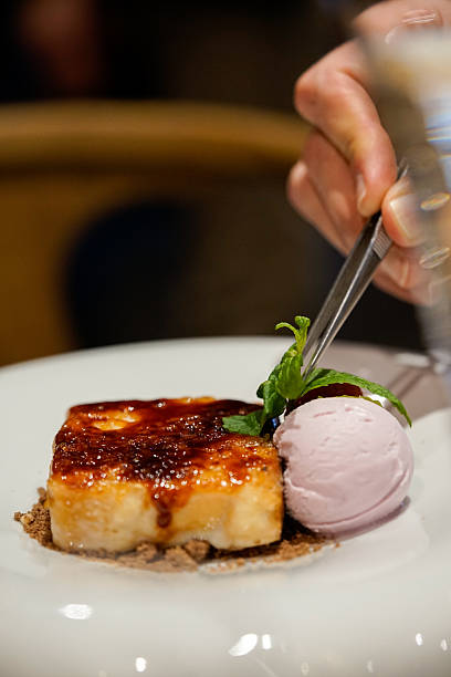 Chef Plating Caramelized Dessert with Ice Cream Fine Dining Service