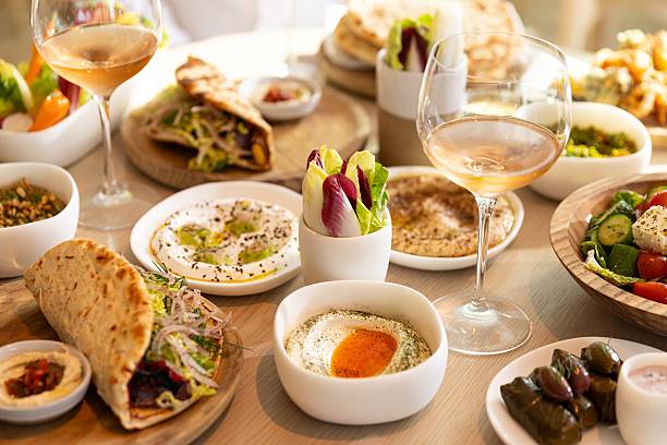 Mediterranean Mezze Platter with Rose Wine and Middle Eastern Dishes