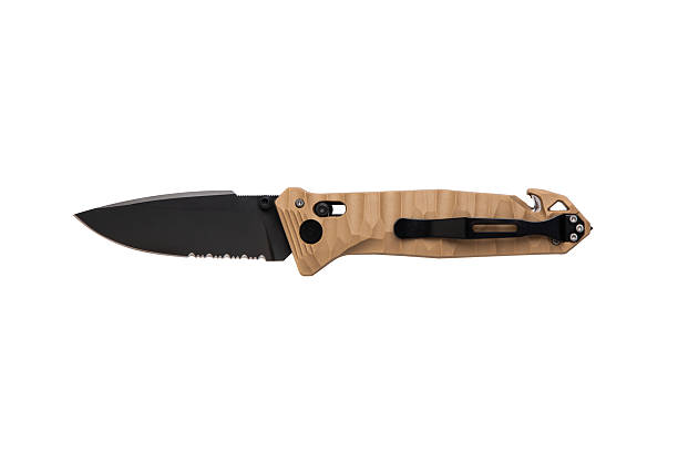istock Opened tactical folding knife with a black semi-serrated blade and tan textured handle. 2244200445