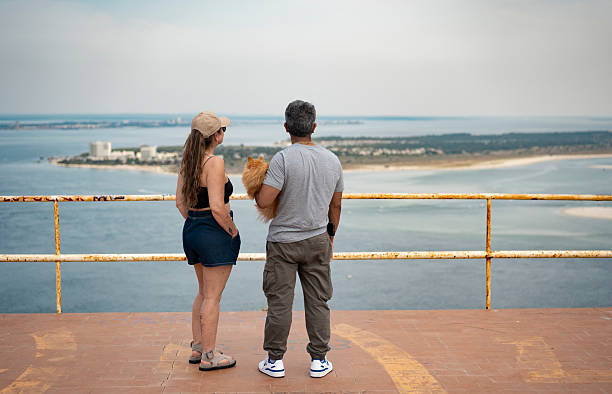 Tourists at a viewpoint in the Serra da Arrábida, Setúbal, Portugal