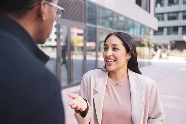 istock Businesswomen having outdoor discussion, collaborating and networking 2244203842