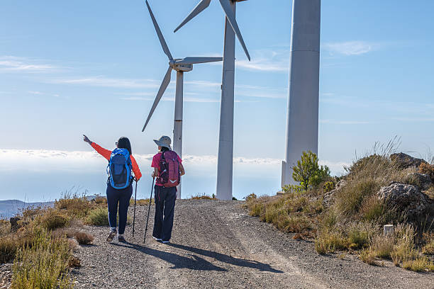 istock Hikers enjoying nature while exploring wind farm trails on a sunny day 2244206470