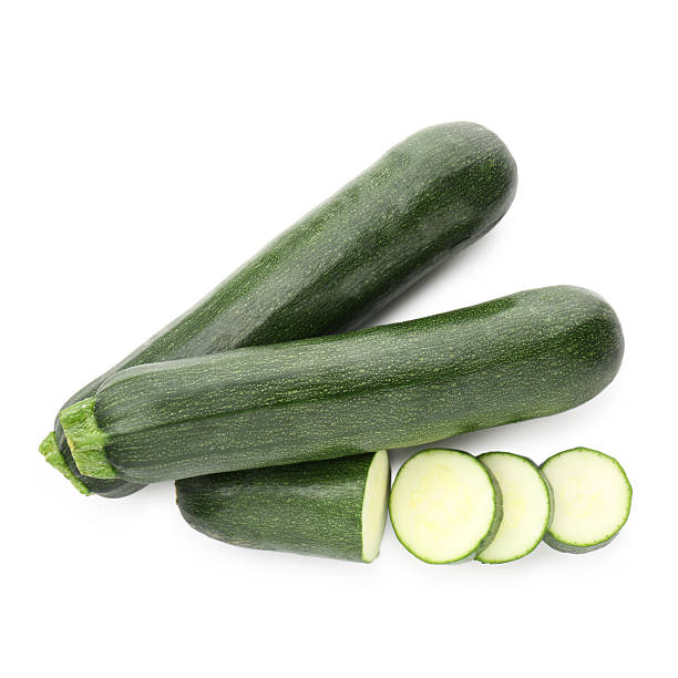 istock Whole and cut fresh zucchinis isolated on white, top view 2244206547