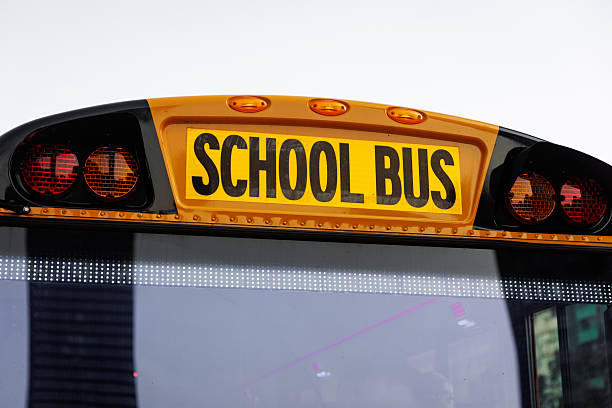 Seattle, Washington, USA. Yellow school bus rides on the city road