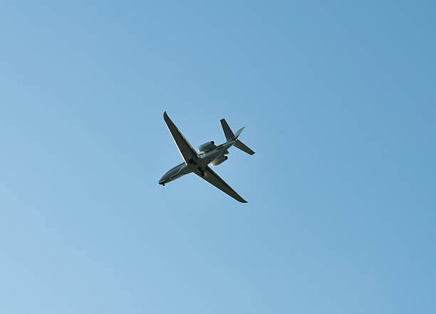 istock small plane flying low in the sky with space for text 2244210768
