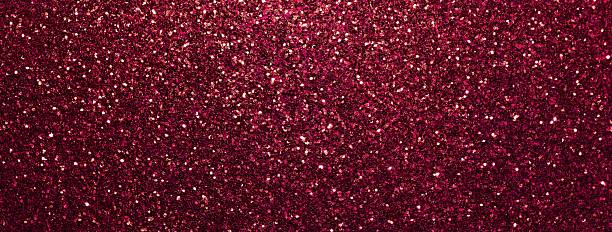istock Dark red sparkling background from small sequins, macro. Shiny wine glitter backdrop for Christmas or New Year 2244210855
