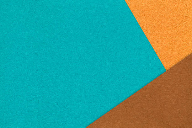 istock Abstract turquoise, orange and brown paper background with copy space. Template for presentation, banner, card design 2244211015