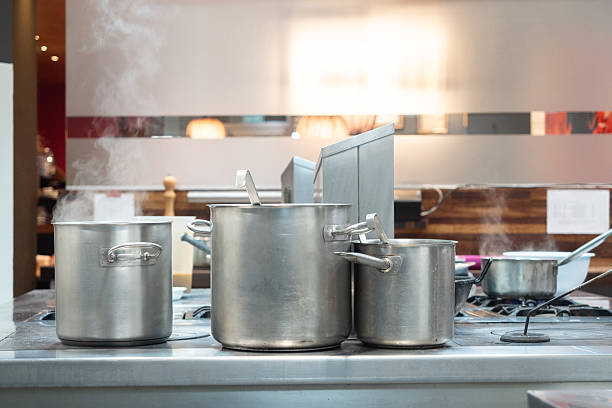 istock Stainless steel pots steaming on a restaurant stove 2244211785