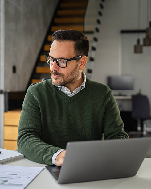 istock Mature man working from home office smiling during video call 2244213023