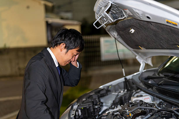 istock Salesman checking the engine but not understanding the cause 2244214156