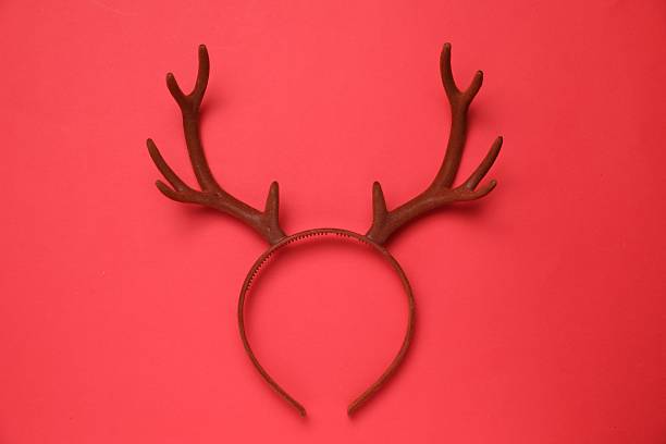 istock Beautiful reindeer headband on red background, top view. Christmas accessory 2244217214