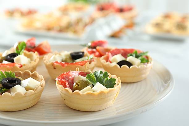 istock Many tasty canapes on white table, closeup 2244218922